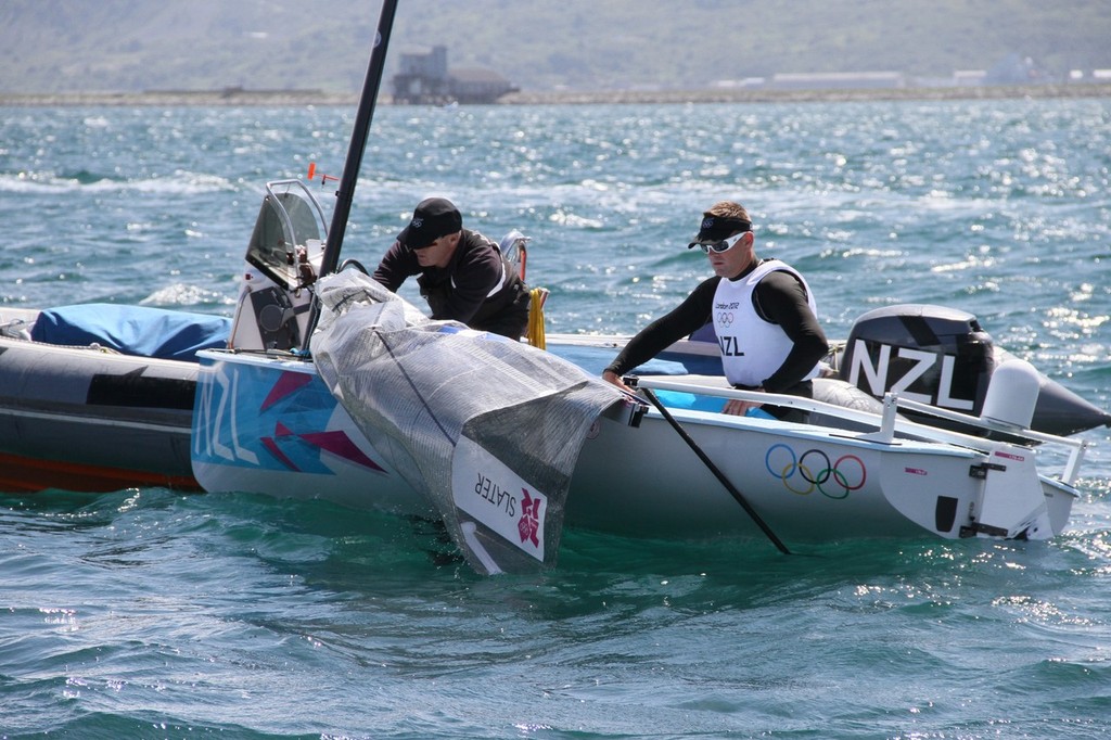 July 28, 2012 Dan Slater (NZL) changes sail Mens Heavyweight Singlehander - Finn photo copyright Richard Gladwell www.photosport.co.nz taken at  and featuring the  class