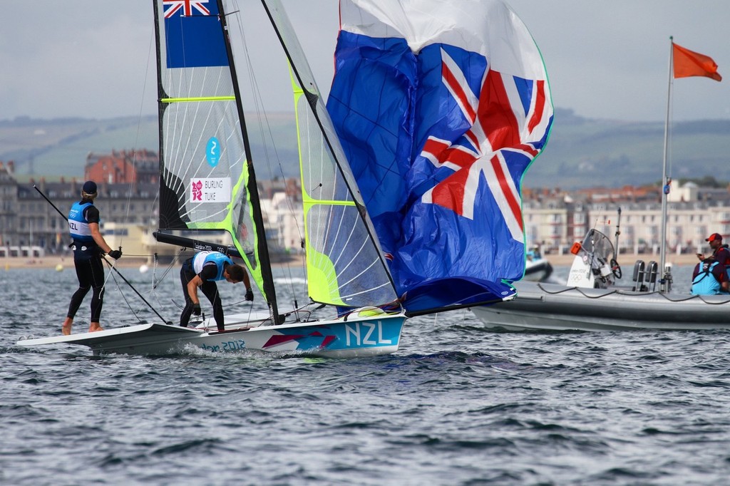  August 8, 2012 - Weymouth, England - Burling and Tuke cross the finish line winning their Silver Medal in the 49er class photo copyright Richard Gladwell www.photosport.co.nz taken at  and featuring the  class