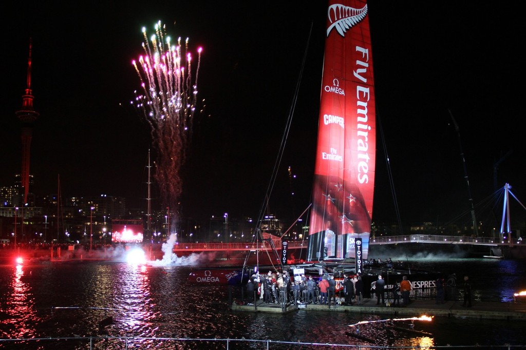 July 21, 2012 America’s Cup - Emirates Team NZ Launch at the Viaduct Harbour, Auckland. Fireworks follow the namimg ceremony. The Sky Tower is dressed in red © Richard Gladwell www.photosport.co.nz