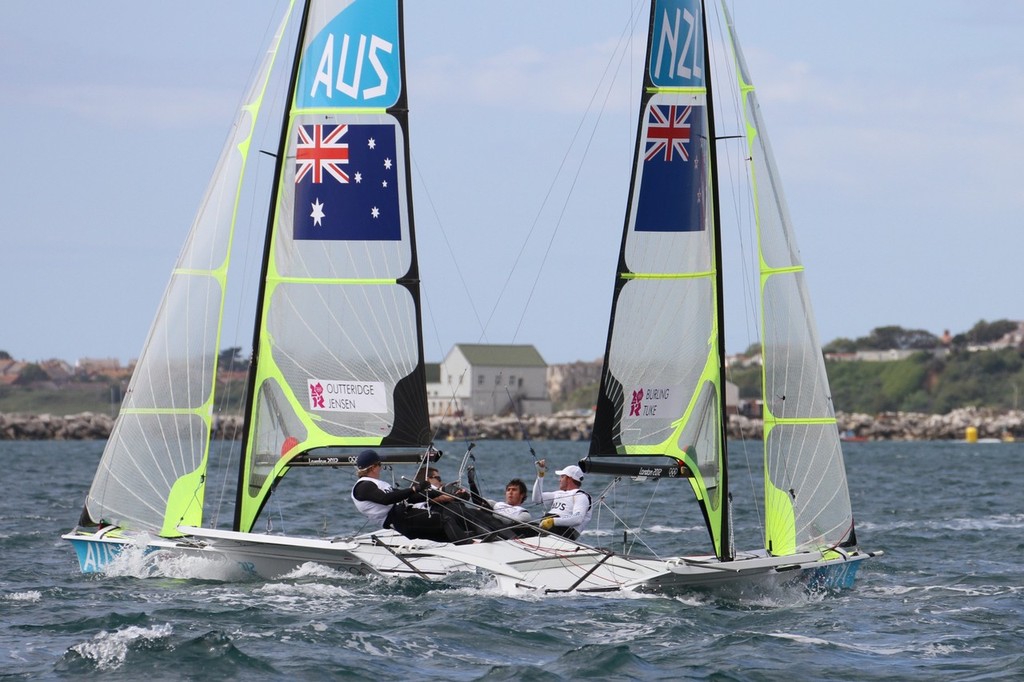 July 30, 2012 Weymouth, England - Mens Skiff (49er) Peter Burling and Blair Tuke (NZL) cross behind Nathan Outteridge and Iain Jensen (AUS) - photo © Richard Gladwell www.photosport.co.nz