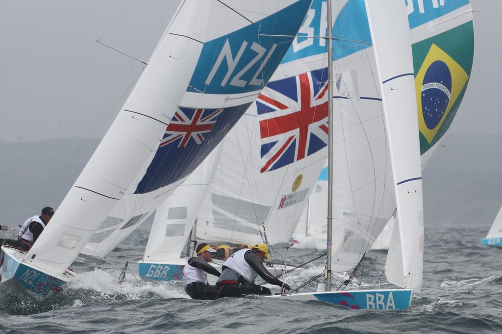 July 31, 2012  Mens Two Handed Keelboat - First mark of the Two man Mens Keelboat (Star) class, with Robert Scheidt and Bruna Prada (BRA) to leeward. Iain Percy and Andrew Simpson (GBR) and Hamish Pepper and Jim Turner (NZL) photo copyright Richard Gladwell www.photosport.co.nz taken at  and featuring the  class