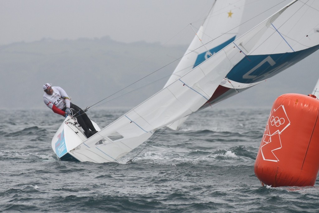 July 31, 2012  Mens Two Handed Keelboat - Richard Clarke and Tyler Bjorn caught in a bad sea at Mark 1 Race 1 © Richard Gladwell www.photosport.co.nz
