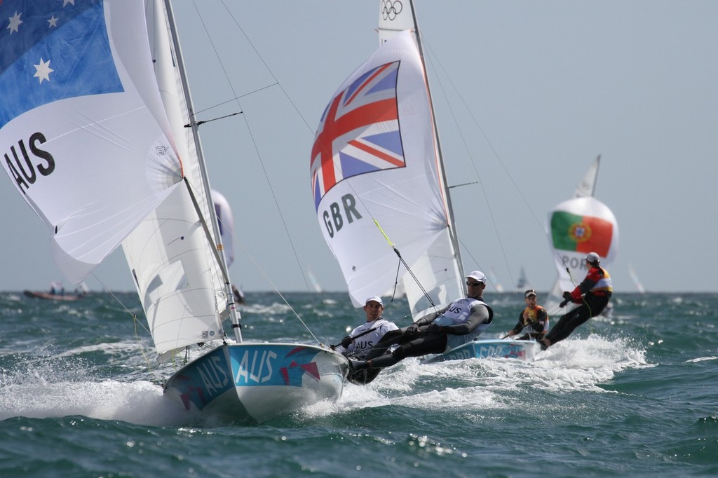  August 3, 2012 - Weymouth, England - Mathew Belcher and Malcolm Page (AUS) lead Luke Patience and Stuat Bithell (GBR) in the Mens 470 finish © Richard Gladwell www.photosport.co.nz