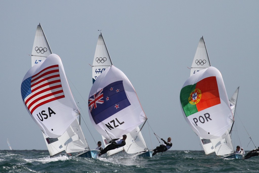 New Zealand’s Paul Snow Hansen and Jason Saunders challenge Stuart McNay and Graham Biehl (USA) going for the finish of Race 3 in the Mens 470 at the 2012 Olympic Regatta © Richard Gladwell www.photosport.co.nz