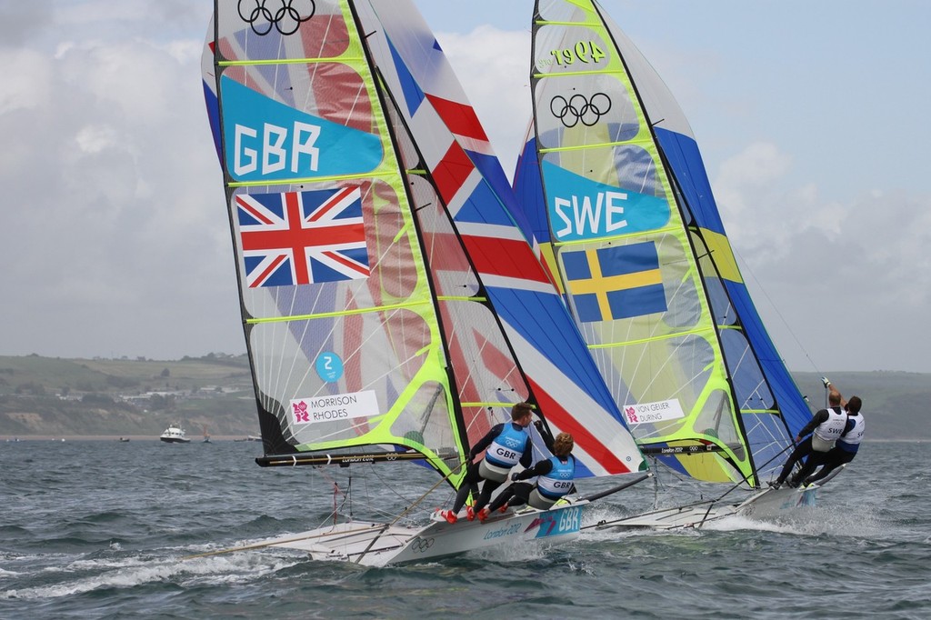  August 3, 2012 - Weymouth, England - Stevie Morrison and Ben Rhodes (GBR) chase Jonas van Geijer and Niclas During (SWE) in Race 11 of the 49er class © Richard Gladwell www.photosport.co.nz
