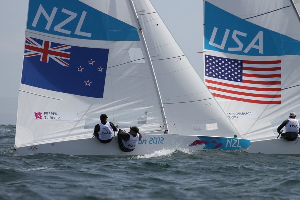  August 3, 2012 - Weymouth, England - New Zealand’s Hamish Pepper and Jim Turner chase Mark Mendelbaltt and Brian Faith (USA) out of the start of Race 7 © Richard Gladwell www.photosport.co.nz