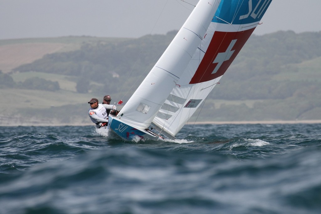  August 3, 2012 - Weymouth, England - Swiss crew Flavio Marazzi and Enrico de Maria approach the top mark in Race 7 of the Star class © Richard Gladwell www.photosport.co.nz