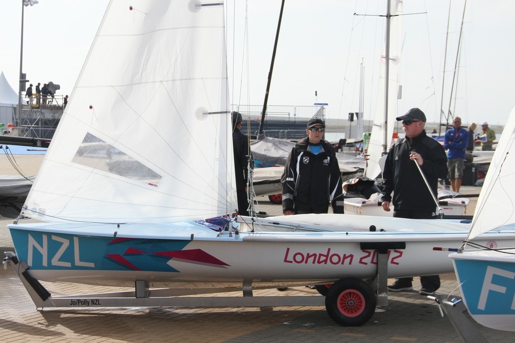  August 4, 2012 - Weymouth, England - Jo Aleh (left) confers with NZL Sailing Team Rules expert, Jack Lloyd soon after arriving ashore in Weymouth, ahead of the pending protest hearing. photo copyright Richard Gladwell www.photosport.co.nz taken at  and featuring the  class