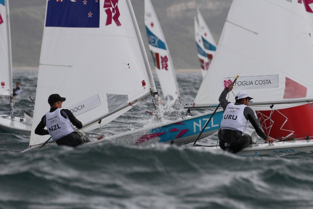  August 4, 2012 - Weymouth, England - Andrew Murdoch (NZL) leaps out of a wave as he is about to round the gybe mark in Race 9, he finished third in both races today, but cannot win the Bronze Medal photo copyright Richard Gladwell www.photosport.co.nz taken at  and featuring the  class