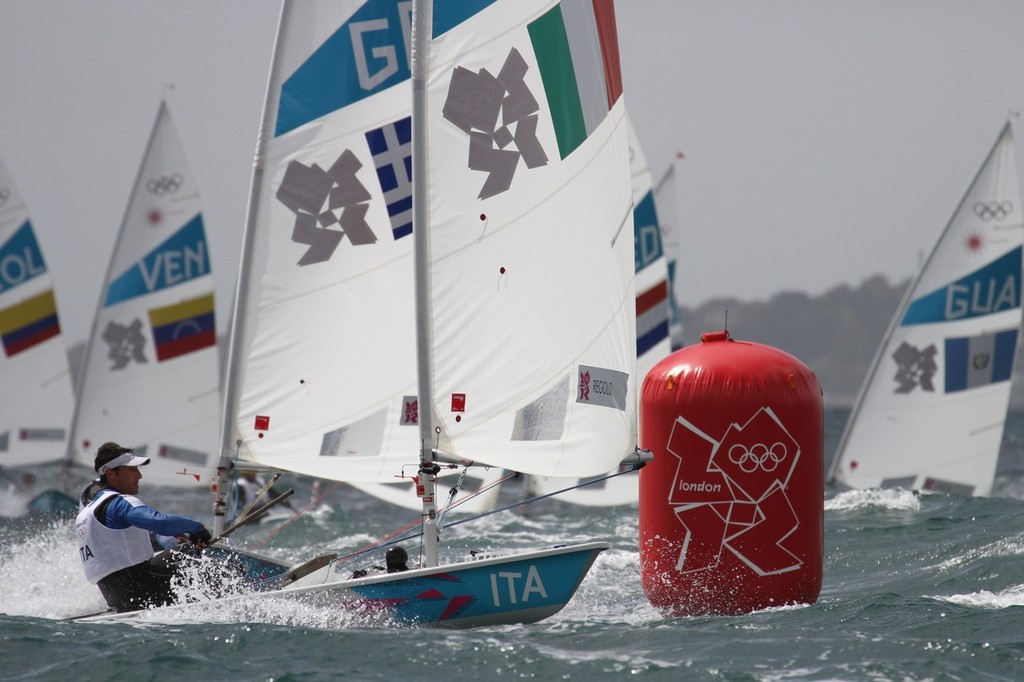  August 4, 2012 - Weymouth, England - Michele Regolo (ITA) powers around the gybe mark in the fresh winds of Weymouth Bay in Race 9 of the Mens Singlehander (Laser) class photo copyright Richard Gladwell www.photosport.co.nz taken at  and featuring the  class