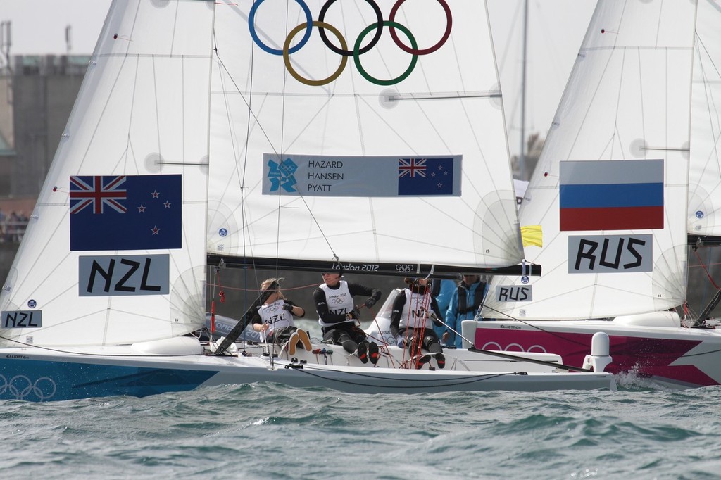  August 4, 2012 - Weymouth, England - The New Zealand crew fight elimination against the second placed Russian crew in the final day of the Qualification Round. photo copyright Richard Gladwell www.photosport.co.nz taken at  and featuring the  class