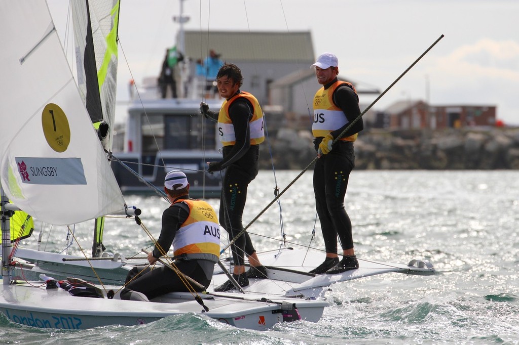 In a time long long ago,in Weymouth, England - Nathan Outteridge and Iain Jensen chat with Tom Slingsby before starting their final two Olympic medal races    © Richard Gladwell www.photosport.co.nz