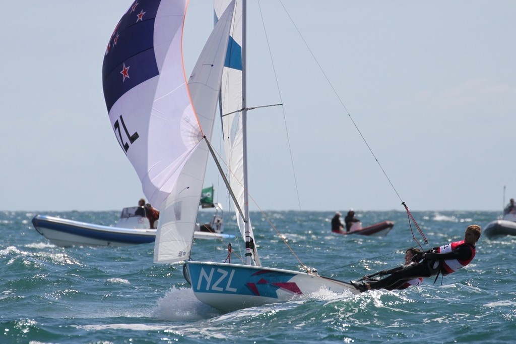 Paul Snow-Hansen and Jason Saunders cross the finish line in seventh place in Race 7 of the 2012 Olympic Regatta, Weymouth &copy; Richard Gladwell www.photosport.co.nz