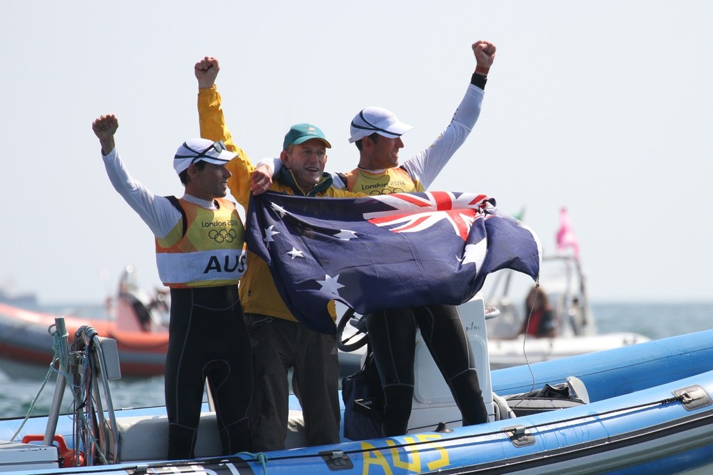 Mathew Belcher and Malcom Page celebrating their Gold Medal win in the Mens 470 - with coach Victor Kavalenko - his sixth Olympic Gold as a coach © Richard Gladwell www.photosport.co.nz
