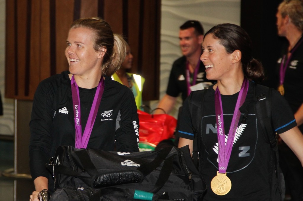 Olivia Powrie (Womens 470 Gold), Jo Aleh (Womens 470 - Gold) sport thier families and friends on their arrival at Auckland Airport © Richard Gladwell www.photosport.co.nz
