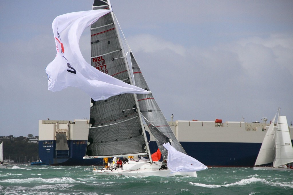 Ran Tan in strife after the start of the 2012 Coastal Classic photo copyright Richard Gladwell www.photosport.co.nz taken at  and featuring the  class