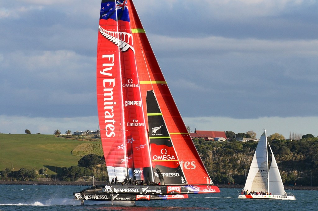 Emirates Team NZ&rsquo;s AC72 drops in on the Friday night Rum Race after her seventh day of sailing. photo copyright Richard Gladwell www.photosport.co.nz taken at  and featuring the  class