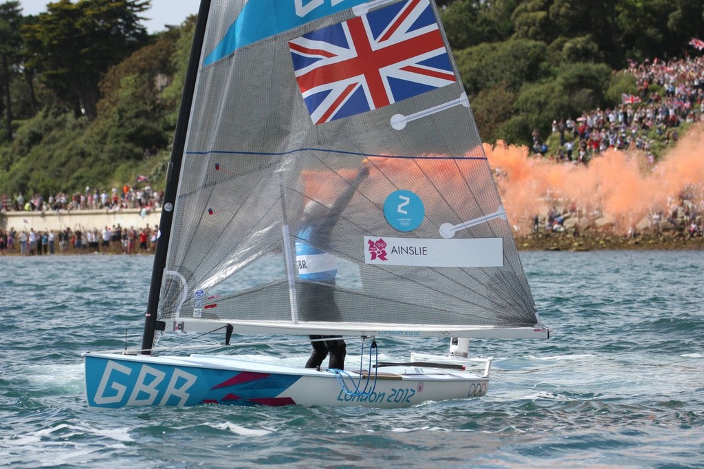  August 5, 2012 - Weymouth, England - Ben Ainslie lets off two smoke flares to acknowledge the crowd after his Gold Medal win © Richard Gladwell www.photosport.co.nz