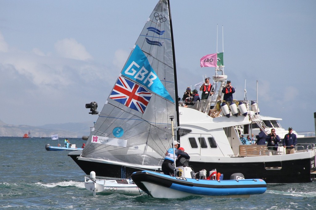  August 5, 2012 - Weymouth, England - Ben Ainslie greets his coach David Howlett soon after the win photo copyright Richard Gladwell www.photosport.co.nz taken at  and featuring the  class