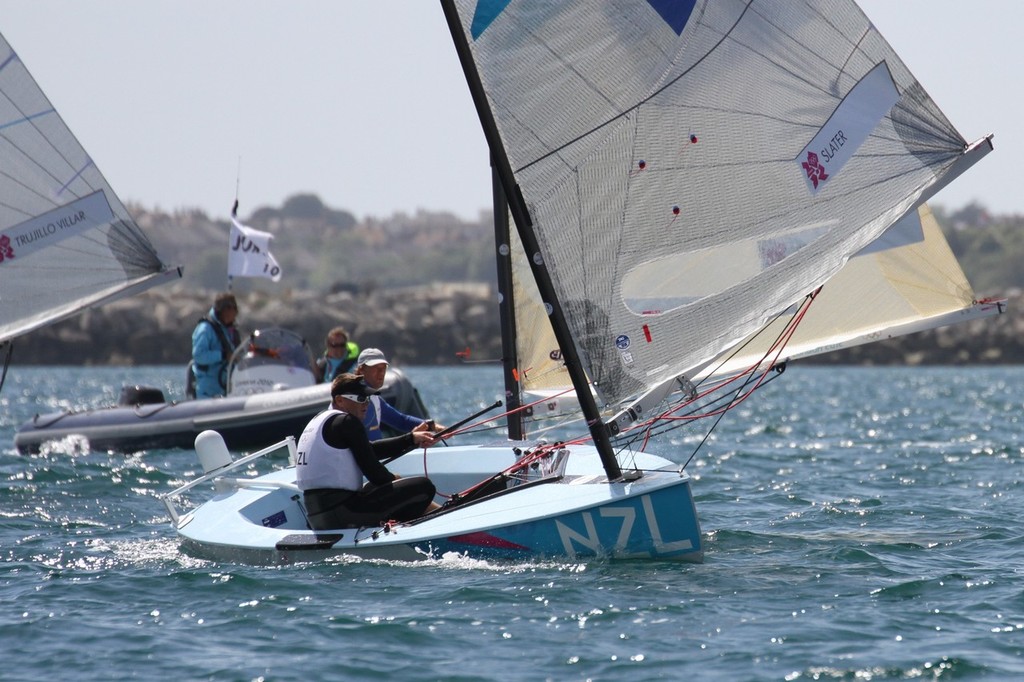  August 5, 2012 - Weymouth, England - Dan Slater (NZL) runs downwind in second place under the eye of the Jury &copy; Richard Gladwell www.photosport.co.nz