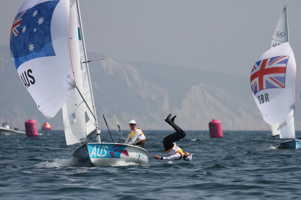  August 10, 2012 - Weymouth, England - Malcolm Page does a back flip off the Australian Mens 470 celebrating their Gold Medal win - the Silver Medalist (GBR) are yet to finish © Richard Gladwell www.photosport.co.nz