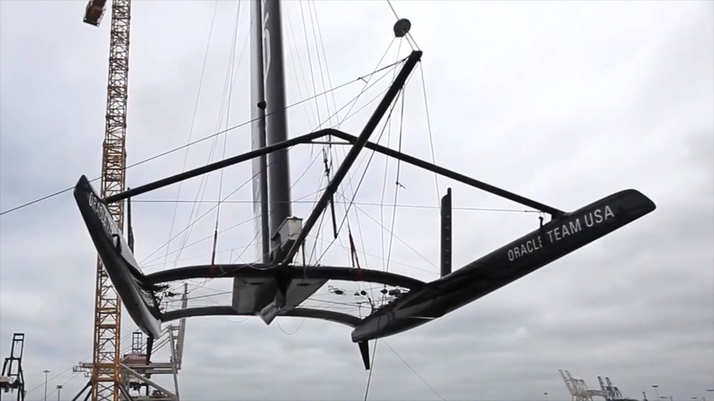 USA-17 is hoisted from the water with the end of the starboard foil missing, AC72 - First Sail - August 31, 2012 San Francisco © SW