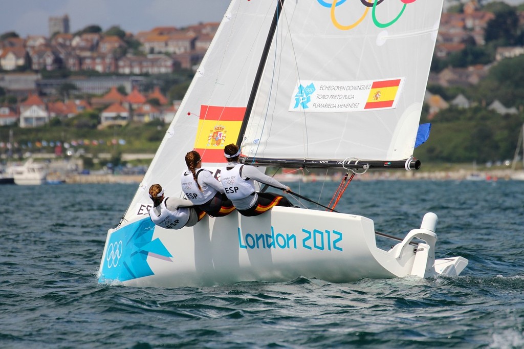 The Spanish Gold Medal winning crew head for the crowd in the Elliotts - Weymouth 2012 Olympic Regatta photo copyright Richard Gladwell www.photosport.co.nz taken at  and featuring the  class