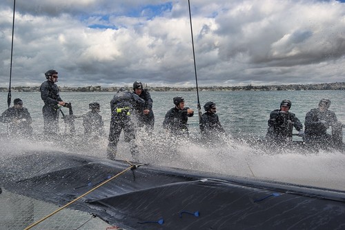 The crew are constantly wet with spray from the tip of the daggerboard when it clips the surface of the sea. © Chris Cameron/ETNZ http://www.chriscameron.co.nz