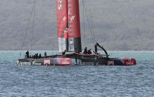 Emirates Team NZ’s AC72 with her port daggerboard in the raised position off Takapuna Beach © Richard Gladwell www.photosport.co.nz