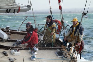 Robin Hewitt behind the helm has taken Yoko on many voyages. Trevor Huggard (yellow cap) been there too. - Helly Hansen Winter Series photo copyright  Alex McKinnon Photography http://www.alexmckinnonphotography.com taken at  and featuring the  class