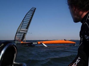 Preparing to release from the rib. You can see how VSR2 is now hanging from the rib at a point at the rear stub beam. The wing is oversheeted and stalled so that the nose of VSR2 swings away from the wind. I usually wait until i am at about 90 degrees twa before releasing.- Vestas Sailrocket 2 photo copyright Dave and Gordon Cameron / Vestas Sailrocket http://www.sailrocket.com/ taken at  and featuring the  class
