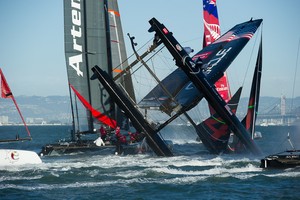 Oracle Team USA digs the bows in and capsizes at the first mark in the first fleet race of day four of the America's Cup World Series, San Francisco. 6/10/2012 photo copyright  SW taken at  and featuring the  class