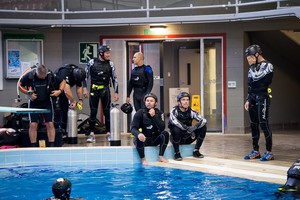 Emirates Team New Zealand AC72 sailors take a break after practicing safety procedures in the Henderson West Wave dive pool. photo copyright Chris Cameron/ETNZ http://www.chriscameron.co.nz taken at  and featuring the  class