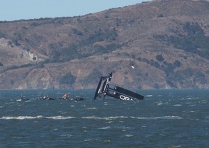 Oracle Team USA capsized in San Francisco Image: Robbie Dean photo copyright Americas Cup Media www.americascup.com taken at  and featuring the  class