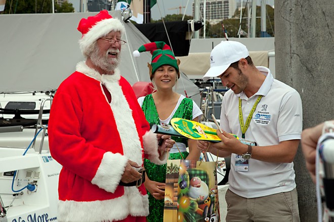 Once the presents were unwrapped, the predominantly French crew of Peugeot Surfrider were quick to join in the fun. - Rolex Sydney Hobart Yacht Race ©  Alex McKinnon Photography http://www.alexmckinnonphotography.com