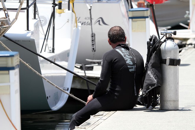 A diver takes a moment’s respite from the rigours of hull cleaning at the CYCA. - Rolex Sydney Hobart Yacht Race ©  Alex McKinnon Photography http://www.alexmckinnonphotography.com