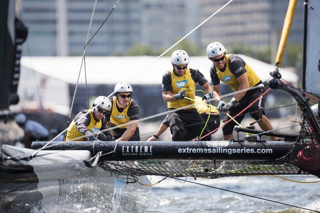 SAP Extreme Sailing Team’s crew put their weight into hoisting their gennaker around a mark. - 2012 Extreme Sailing Series - Act 8 Rio &copy; Lloyd Images http://lloydimagesgallery.photoshelter.com/