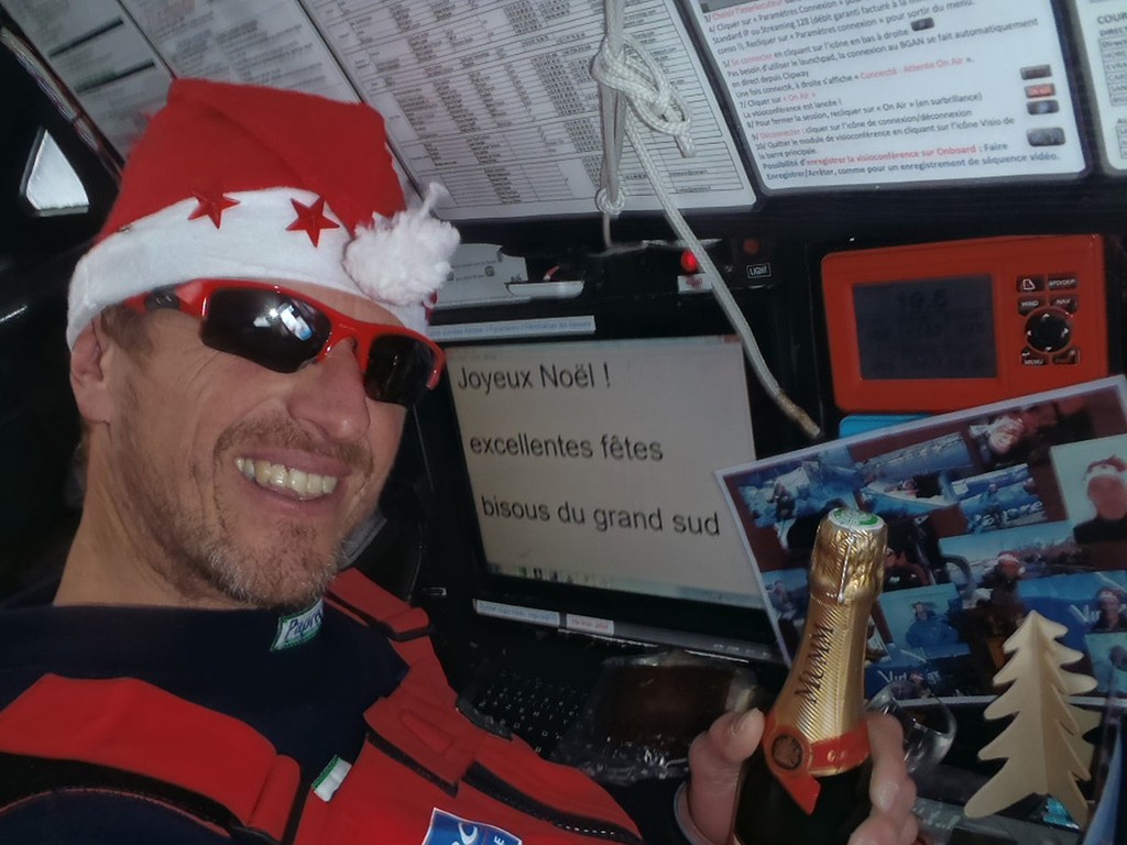 VENDEE GLOBE 2012/2013 - PACIFIC OCEAN - 23/12/2012  - PHOTO JEAN PIERRE DICK (FRA) / VIRBAC PAPREC 3 - JOYEUX NOEL WITH CHAMPAGNE ! photo copyright Jean-Pierre Dick / Virbac-Paprec / Vendée Globe taken at  and featuring the  class