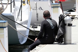 A diver takes a moment's respite from the rigours of hull cleaning at the CYCA. - Rolex Sydney Hobart Yacht Race photo copyright  Alex McKinnon Photography http://www.alexmckinnonphotography.com taken at  and featuring the  class