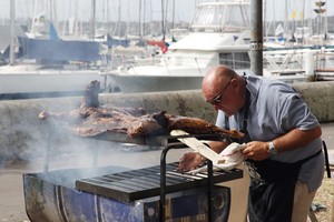 Master varnisher, Julio from Argentina, sets his culinary skills to the celebratory BBQ. - Rolex Sydney Hobart Yacht Race photo copyright  Alex McKinnon Photography http://www.alexmckinnonphotography.com taken at  and featuring the  class