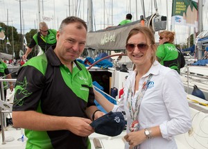 Mark Welsh from Wicked receives last minute gifts from Vicsail Beneteau's Cheryl Stanton. - Rolex Sydney Hobart Yacht Race photo copyright  Alex McKinnon Photography http://www.alexmckinnonphotography.com taken at  and featuring the  class