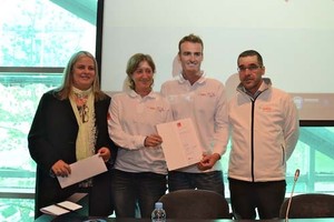 The President of the FNOB Maite Fandos, on the left, before being handed the first registration documents of the Barcelona World Race 2014 by Anna and Gerard. On the right, Antonio Gassó, CEO and Managing Director of GAES. photo copyright Mireia Perelló / FNOB http://www.barcelonaworldrace.org/ taken at  and featuring the  class