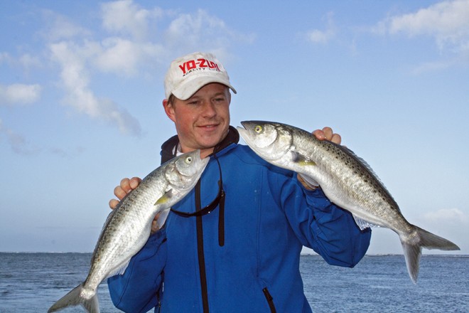 The author with two nice salmon caught while spinning with metal slugs. © Jarrod Day