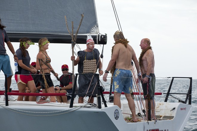 Mt Gay Rum 2013 Neptune Regatta. King Neptune (Ian Walker) inflicts punishment on two Slimy Pollywogs - inc Jamie Boag (r)  © Guy Nowell http://www.guynowell.com