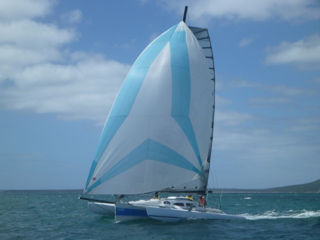 One of the multi-hulls flying along with their spinnaker up - 2013 Lexus Lincoln Regatta Week © Harry Fisher