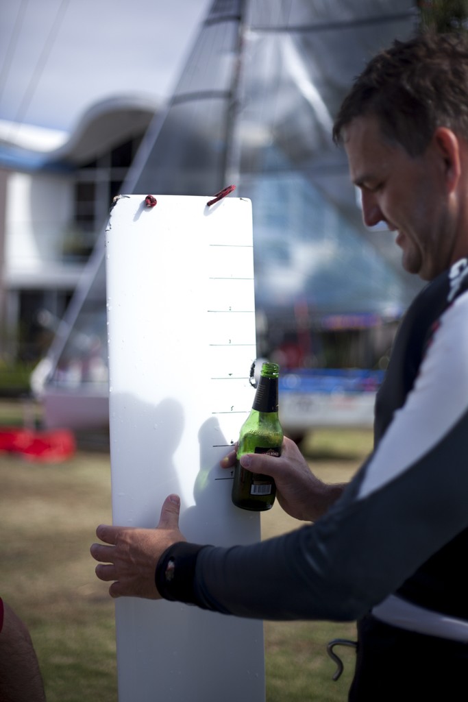 Ian 'Footy' Furlong inspects the damage to their foil after hitting an unidentified flying sea creature  - Australian 14ft Skiff Championships 2012  © Andrew Gough