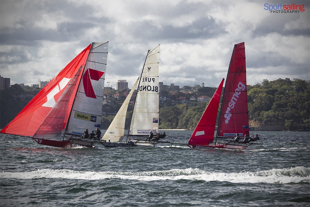 Gotta Luv it 7 gets ahead but can they hold their kite ? - 18ft Skiff JJ Giltinan Championships2013 - Day 4 finish line photo copyright Beth Morley - Sport Sailing Photography http://www.sportsailingphotography.com taken at  and featuring the  class