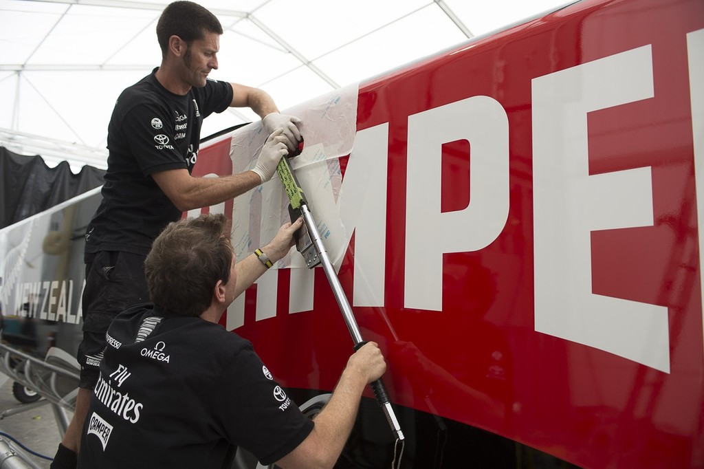 Emirates Team New Zealand shore crewmen Campbell Dickie and Dave French torque up bolts attaching the forward beam to the starboard hull of the teams second AC72. 15/1/2013 photo copyright Chris Cameron/ETNZ http://www.chriscameron.co.nz taken at  and featuring the  class