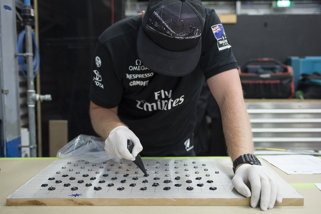 Emirates Team New Zealand' boat builder Dan Brooks preparing mounting fixtures for AC72 number two. 16/1/2013 photo copyright Chris Cameron/ETNZ http://www.chriscameron.co.nz taken at  and featuring the  class