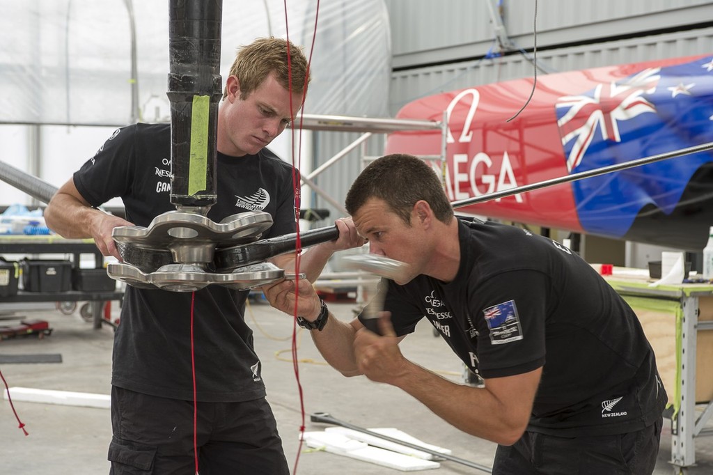 Emirates Team New Zealand, Jack Taylor and Nick Burrige work on the under rigging of the teams second AC72. 15/1/2013 © Chris Cameron/ETNZ http://www.chriscameron.co.nz